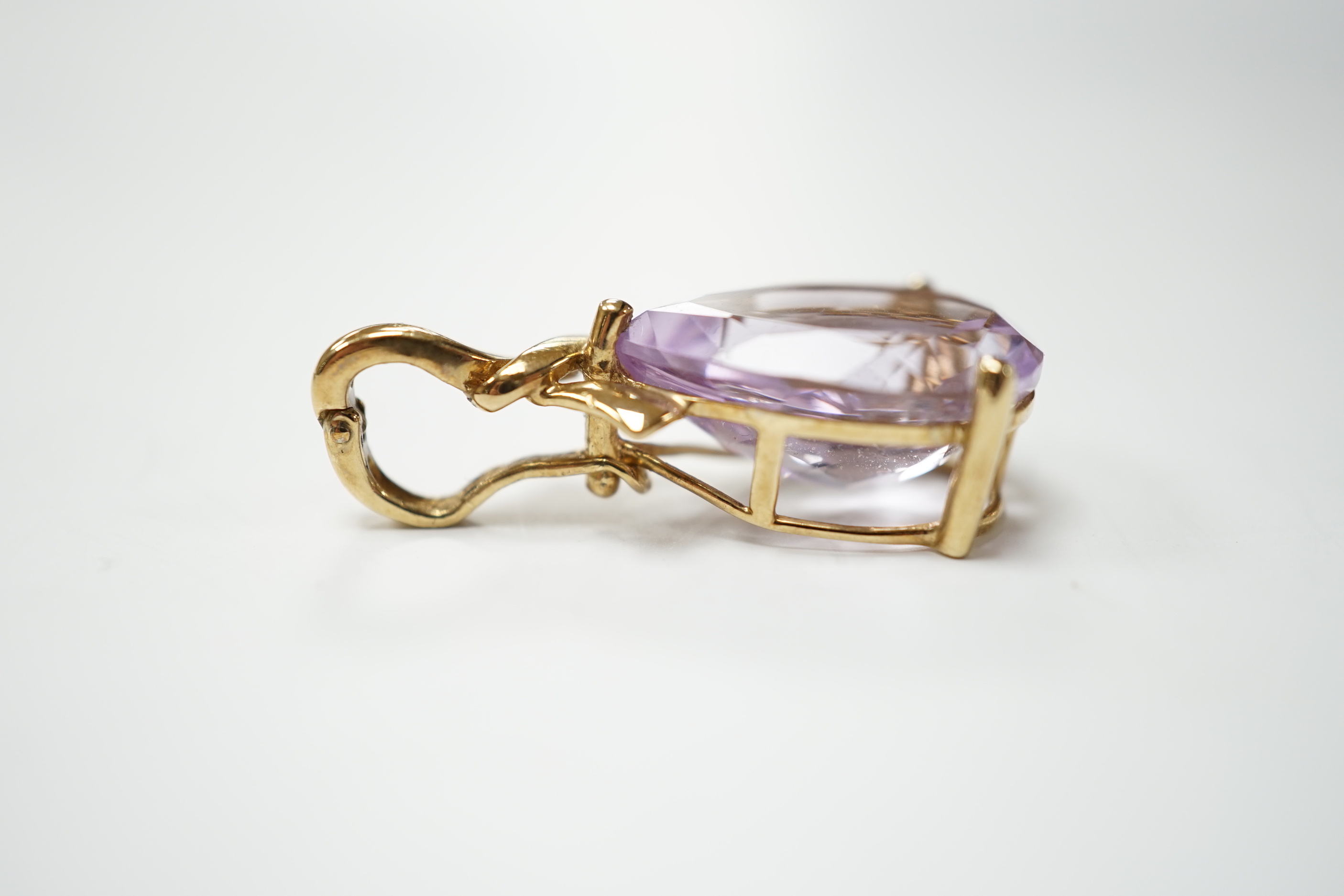 A modern 9ct gold and pear cut amethyst set pendant, 30mm, gross weight 3.9 grams.
